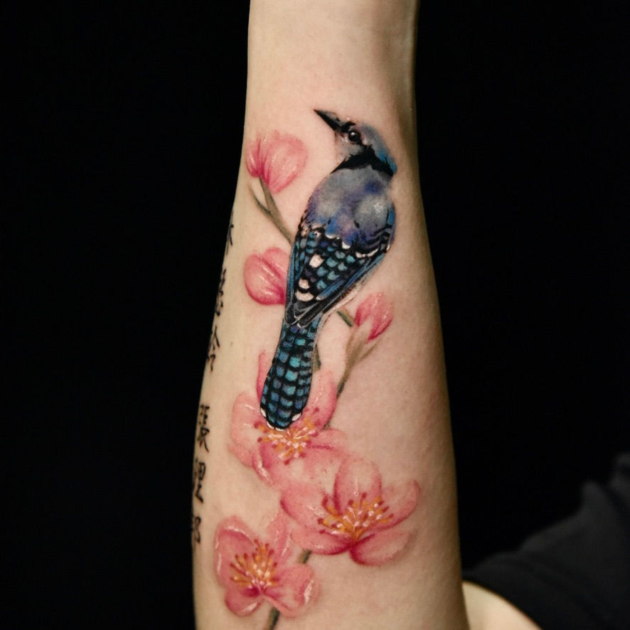 Fine line bird tattoo
