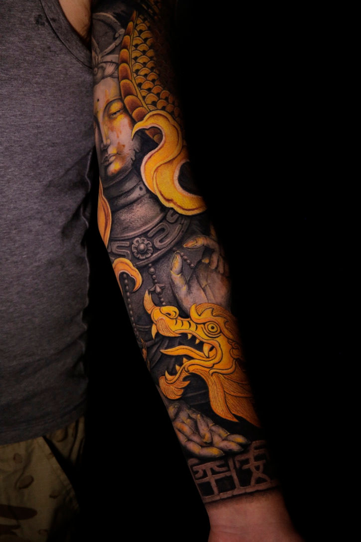 Stone carving style tattoo