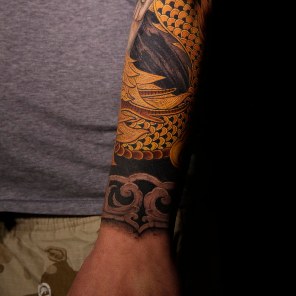 Stone carving style tattoo
